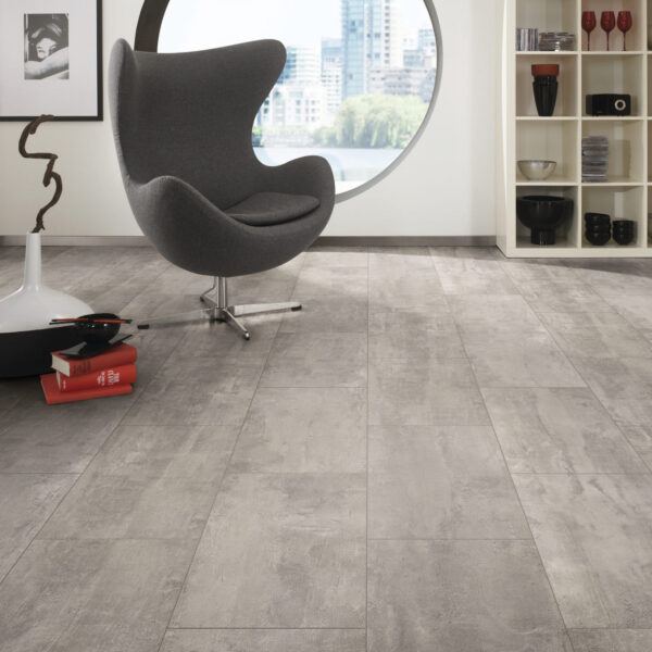 Organic Classic Crosstown Traffic 8mm grey tile-effect laminate flooring in a modern living room