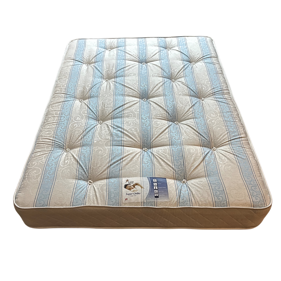 Super Ortho Open Coil Mattress Super Ortho open coil mattress with blue and cream tufted cover